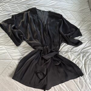 Lulu’s Black Dolman sleeve romper with belt.